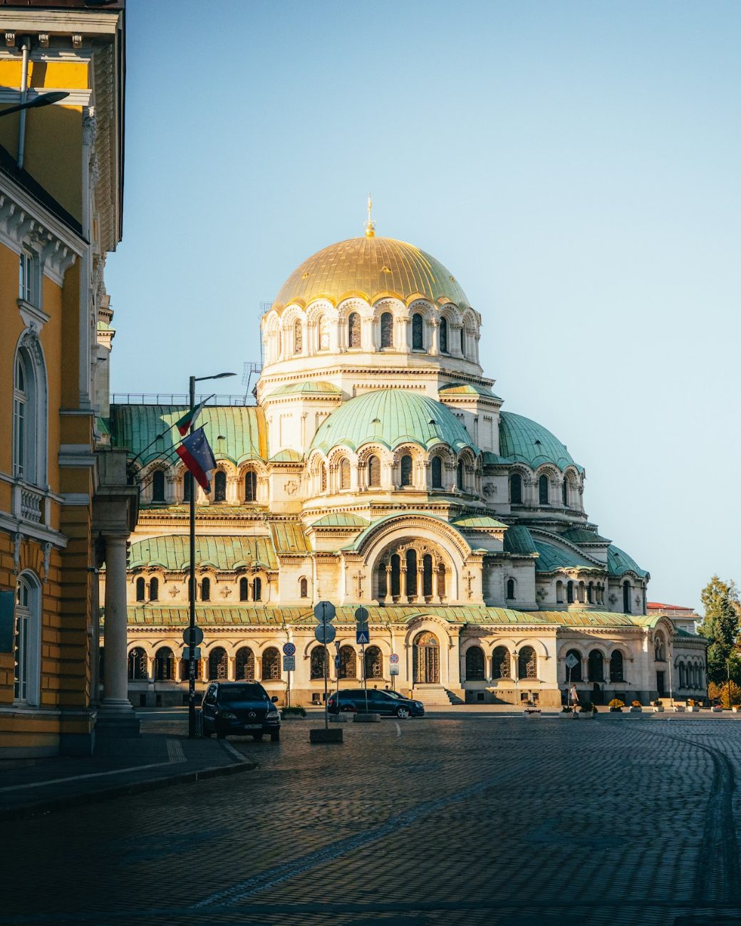 Alexander Nevsky Cathedral in Sofia, its gilded dome lit by the low evening sun