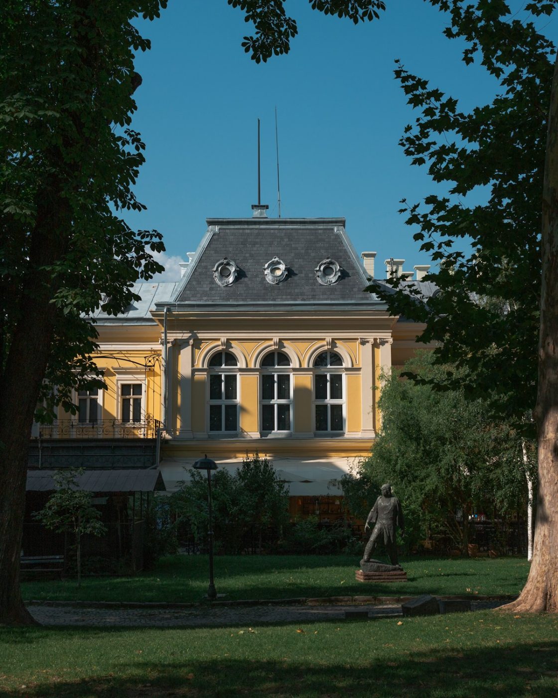 The former Royal Palace in Sofia, now the National Gallery, framed by tall trees